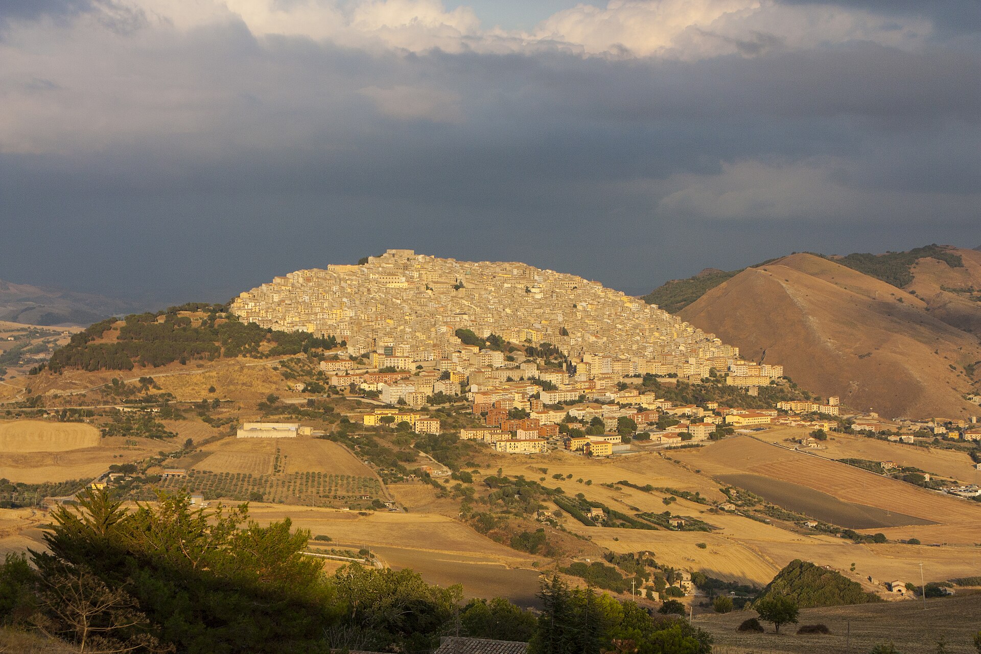 Gangi climbing a hillside in inland Sicily, lit by low sunlight